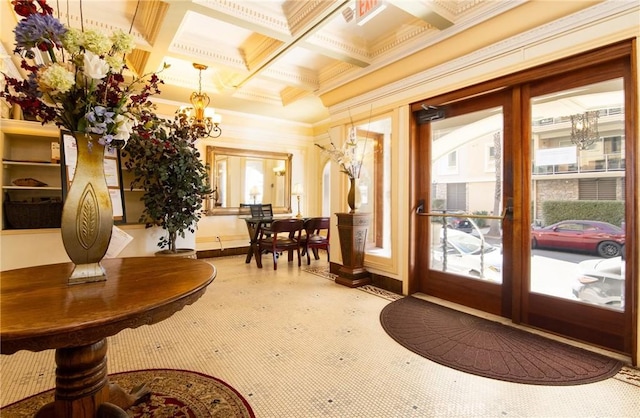 doorway to outside featuring french doors, ornamental molding, coffered ceiling, a chandelier, and beam ceiling