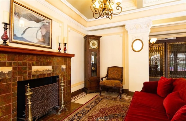 interior space featuring a fireplace, an inviting chandelier, and crown molding