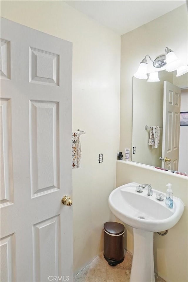 bathroom featuring sink and tile patterned flooring