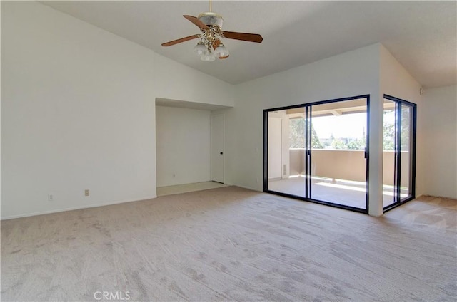 unfurnished room featuring lofted ceiling, light carpet, and ceiling fan