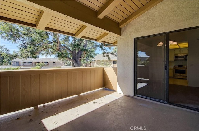 view of patio with a balcony