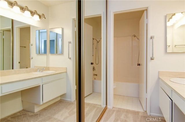 full bathroom featuring shower / bathing tub combination, vanity, and toilet