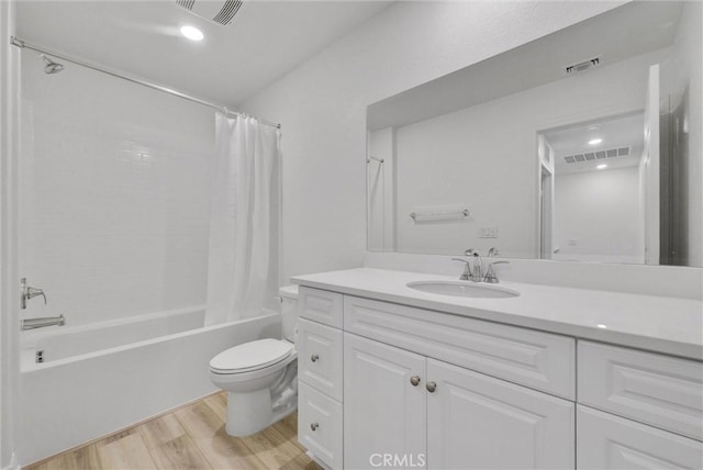 full bathroom with toilet, shower / tub combo, vanity, and hardwood / wood-style flooring