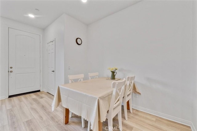 dining area with light hardwood / wood-style floors