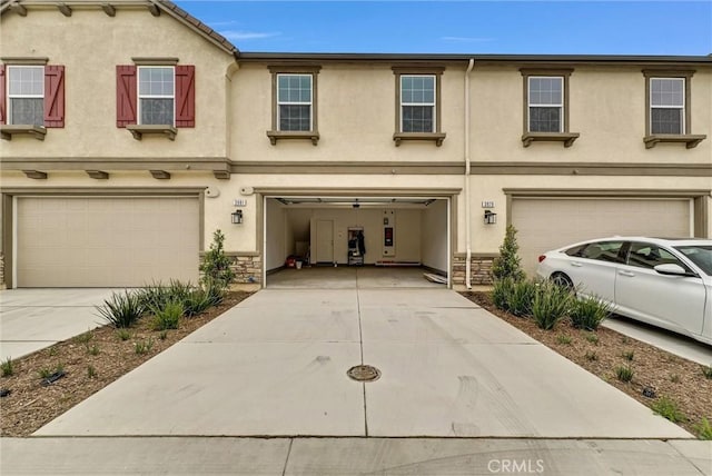 townhome / multi-family property featuring a garage