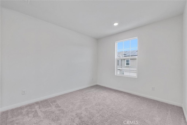 empty room with light colored carpet