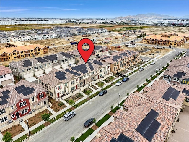 birds eye view of property featuring a mountain view