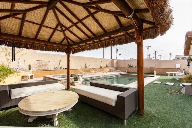 view of patio / terrace featuring a gazebo and a fenced in pool