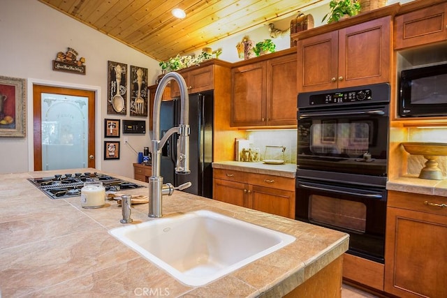 kitchen featuring wooden ceiling, sink, black appliances, and vaulted ceiling