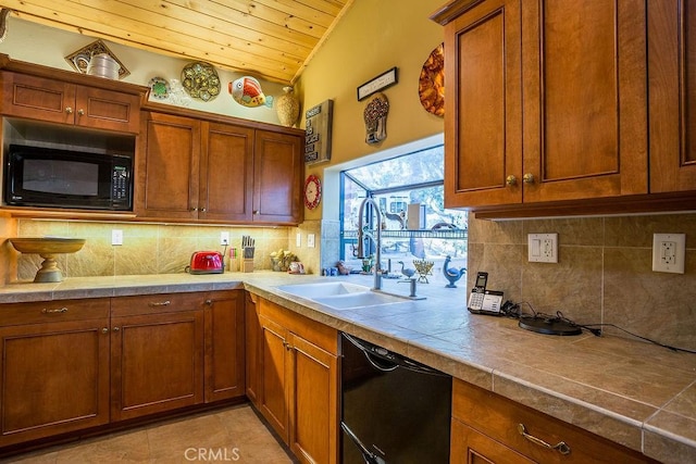 kitchen featuring tile countertops, wooden ceiling, black appliances, sink, and decorative backsplash