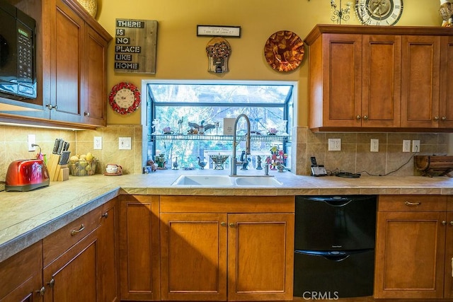 kitchen featuring tasteful backsplash and sink