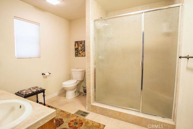 bathroom with tile patterned flooring, vanity, toilet, and an enclosed shower