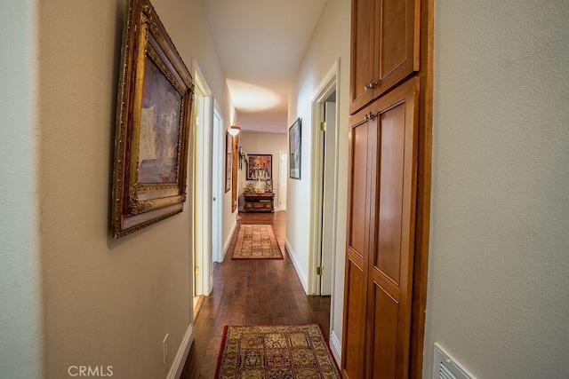 corridor featuring dark wood-type flooring