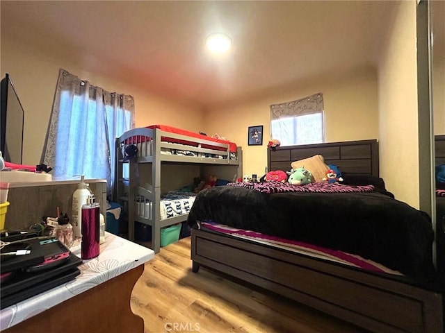 bedroom with light wood-type flooring