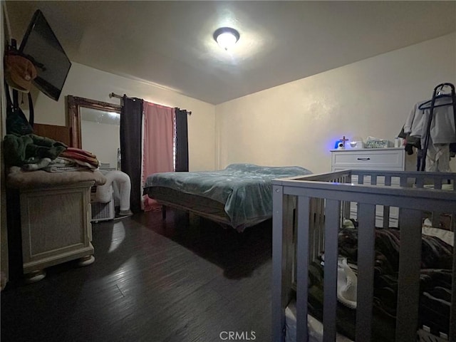 bedroom featuring billiards and dark wood-type flooring