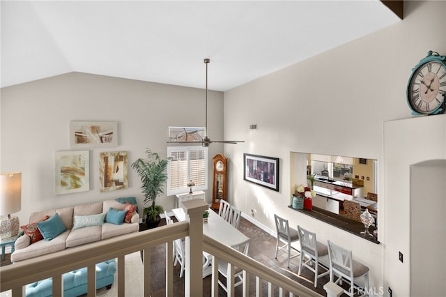 interior space with hardwood / wood-style flooring, ceiling fan, and vaulted ceiling