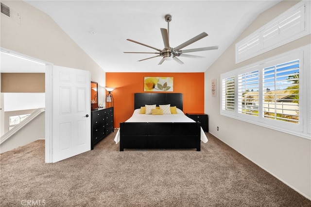 bedroom featuring vaulted ceiling, carpet floors, and ceiling fan