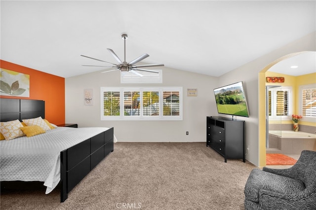 carpeted bedroom featuring ceiling fan, connected bathroom, and lofted ceiling