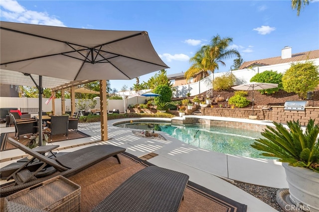 view of pool with a pergola, area for grilling, and a patio area