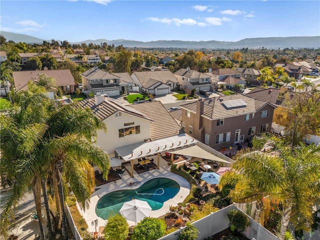 birds eye view of property with a mountain view