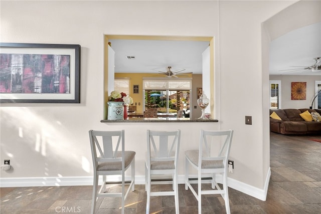 dining space with ceiling fan