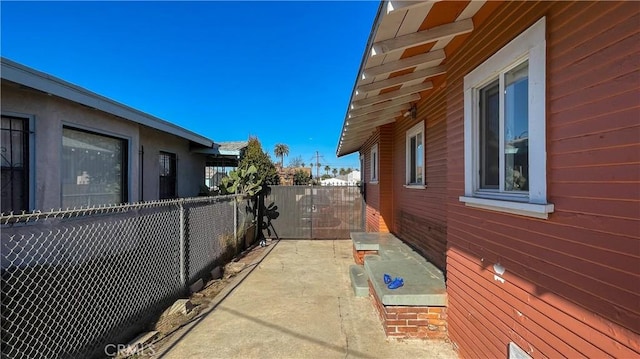 view of side of home with a patio