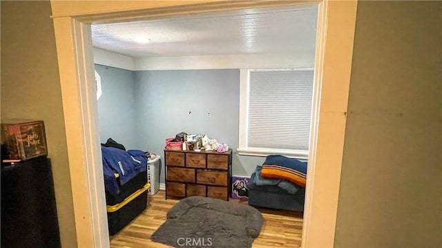 bedroom with light hardwood / wood-style floors