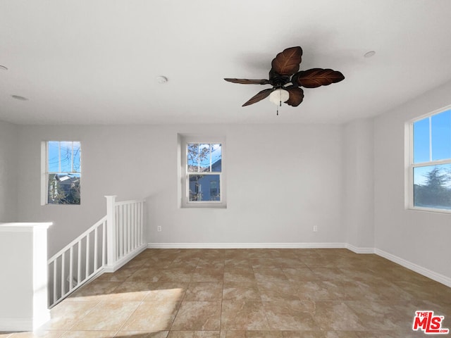 unfurnished room featuring ceiling fan