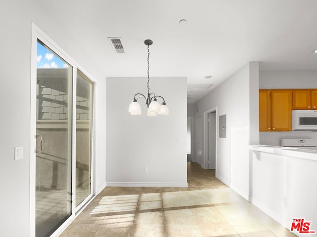 unfurnished dining area with light tile patterned floors, electric panel, and a chandelier