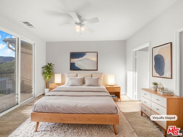 bedroom featuring ceiling fan, light colored carpet, and access to outside