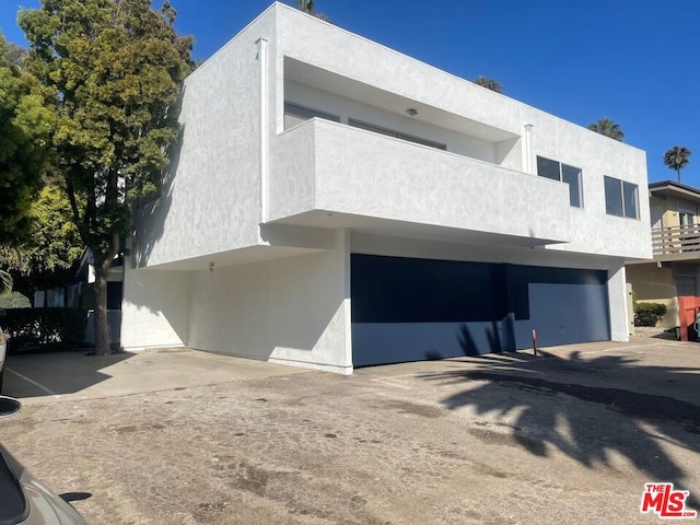 view of front of home with a balcony