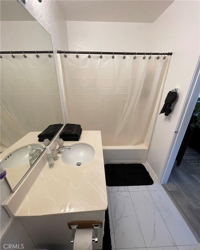 bathroom featuring vanity and shower / tub combo