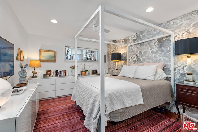 bedroom featuring ceiling fan and hardwood / wood-style flooring