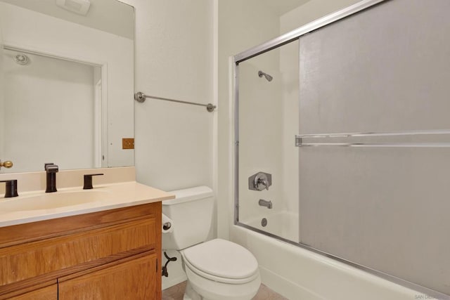 full bathroom featuring toilet, enclosed tub / shower combo, and vanity