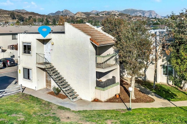 view of building exterior featuring a mountain view