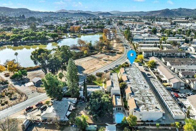 drone / aerial view featuring a water and mountain view