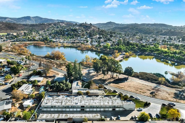 drone / aerial view with a water and mountain view