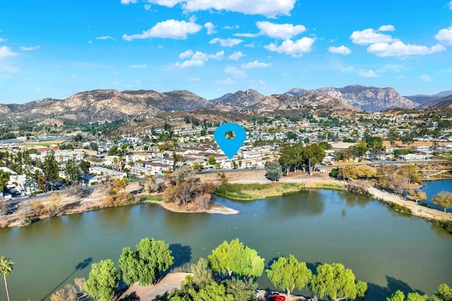 aerial view featuring a water and mountain view