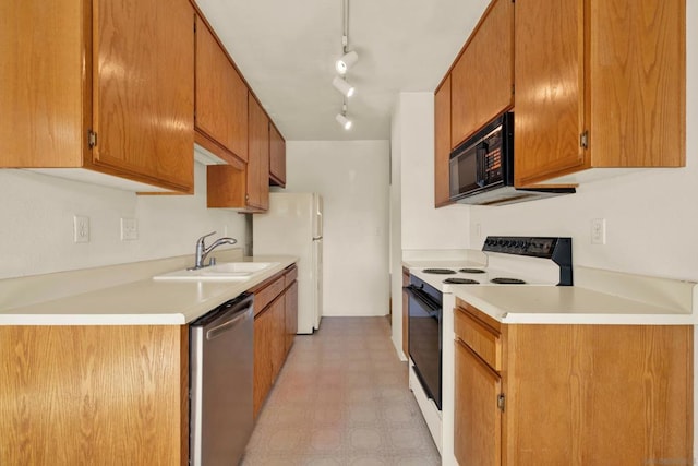 kitchen with electric range oven, sink, dishwasher, and white fridge