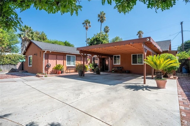 view of front of home featuring a carport