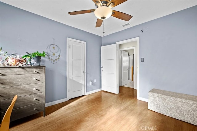 unfurnished bedroom featuring light hardwood / wood-style flooring and ceiling fan