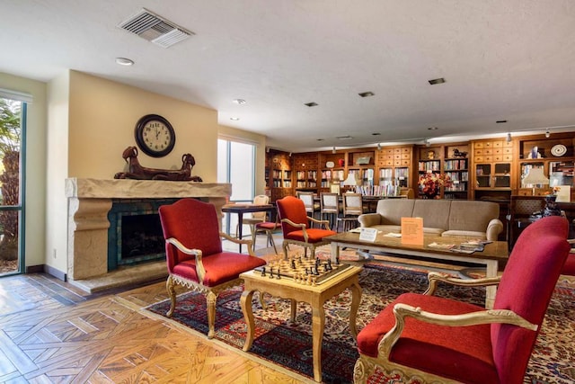 living room featuring parquet flooring