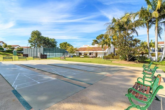 view of home's community with a yard