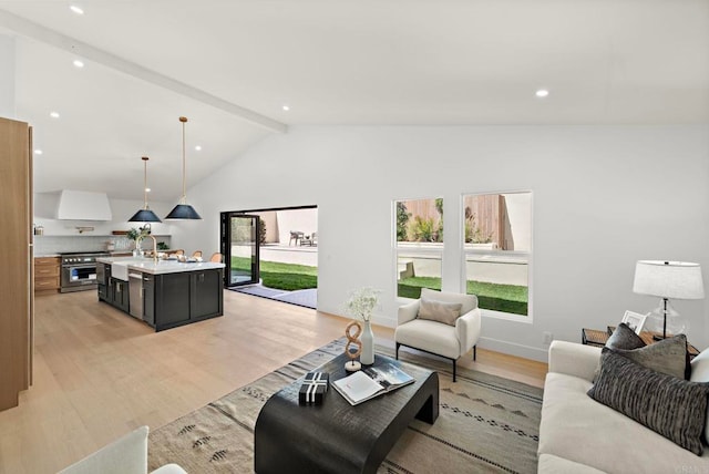 living room with beam ceiling, sink, high vaulted ceiling, and light wood-type flooring