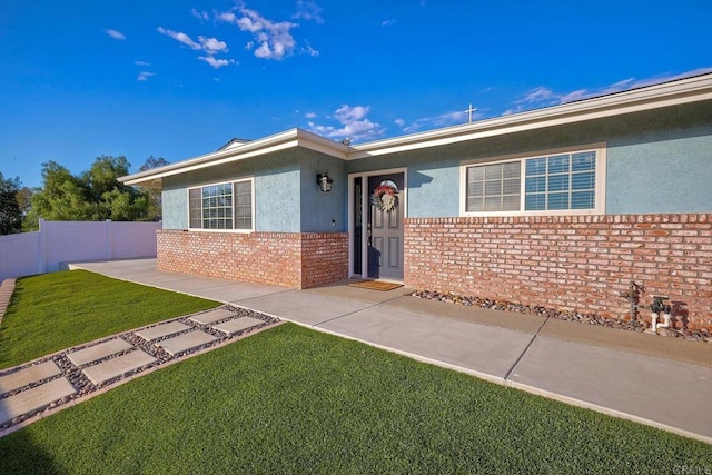 view of front of home with a front yard