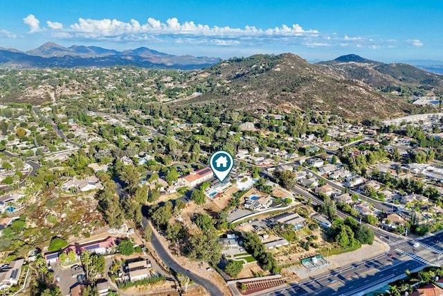 birds eye view of property with a mountain view