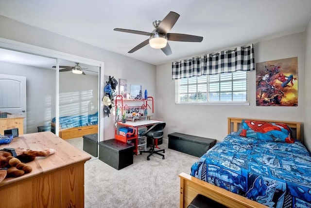 bedroom with carpet flooring, ceiling fan, and a closet