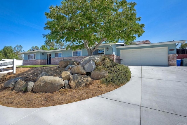 ranch-style home featuring a garage