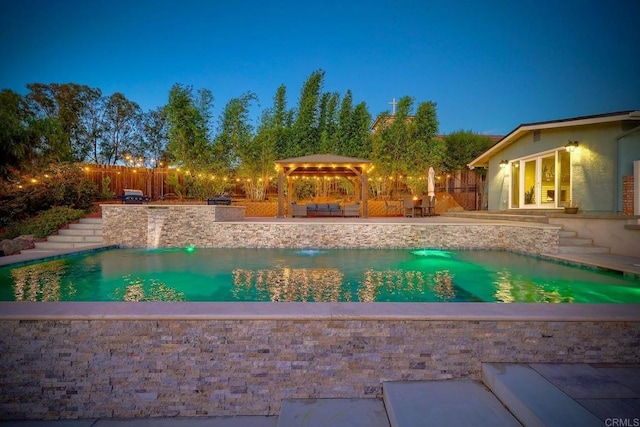 view of pool with an outdoor living space and a patio