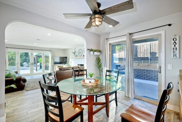 dining area featuring french doors, a wealth of natural light, and ceiling fan